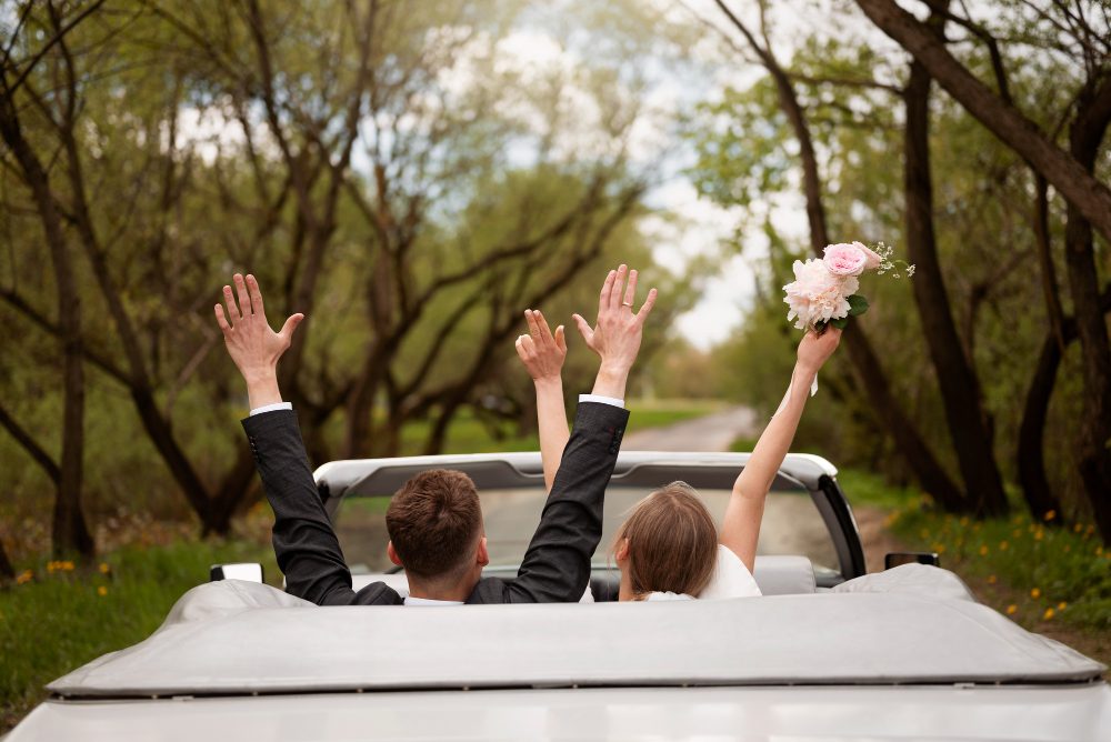 just married couple with their car